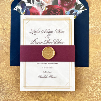 Wax seal and belly band on a marble background wedding invitation 